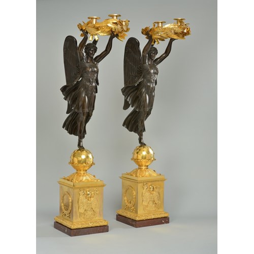 A very important pair of empire ormolu and patinated bronze four-light candelabra